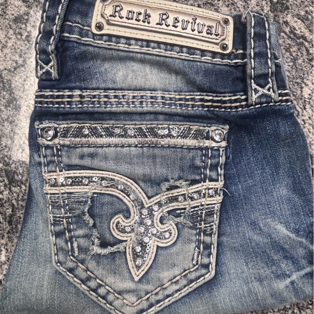 Rock Revival Distressed Blue Jeans with Silver Accents